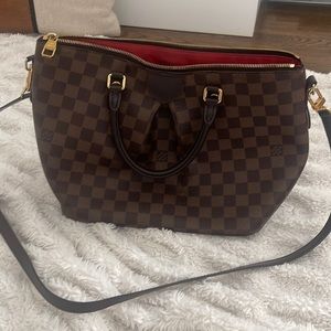 Louis Vuitton too handle bag with crossbody strap.